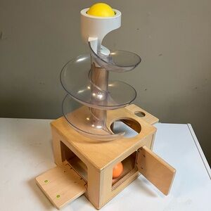 Lovevery slide & seek ball run wood toys.